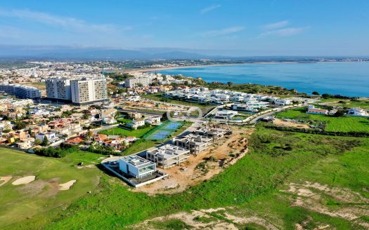 Sea front contemporary villa with swimming pool under construction.